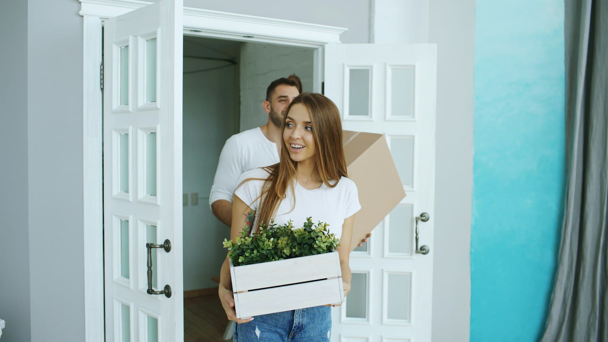 A family unpacking boxes in a bright new home